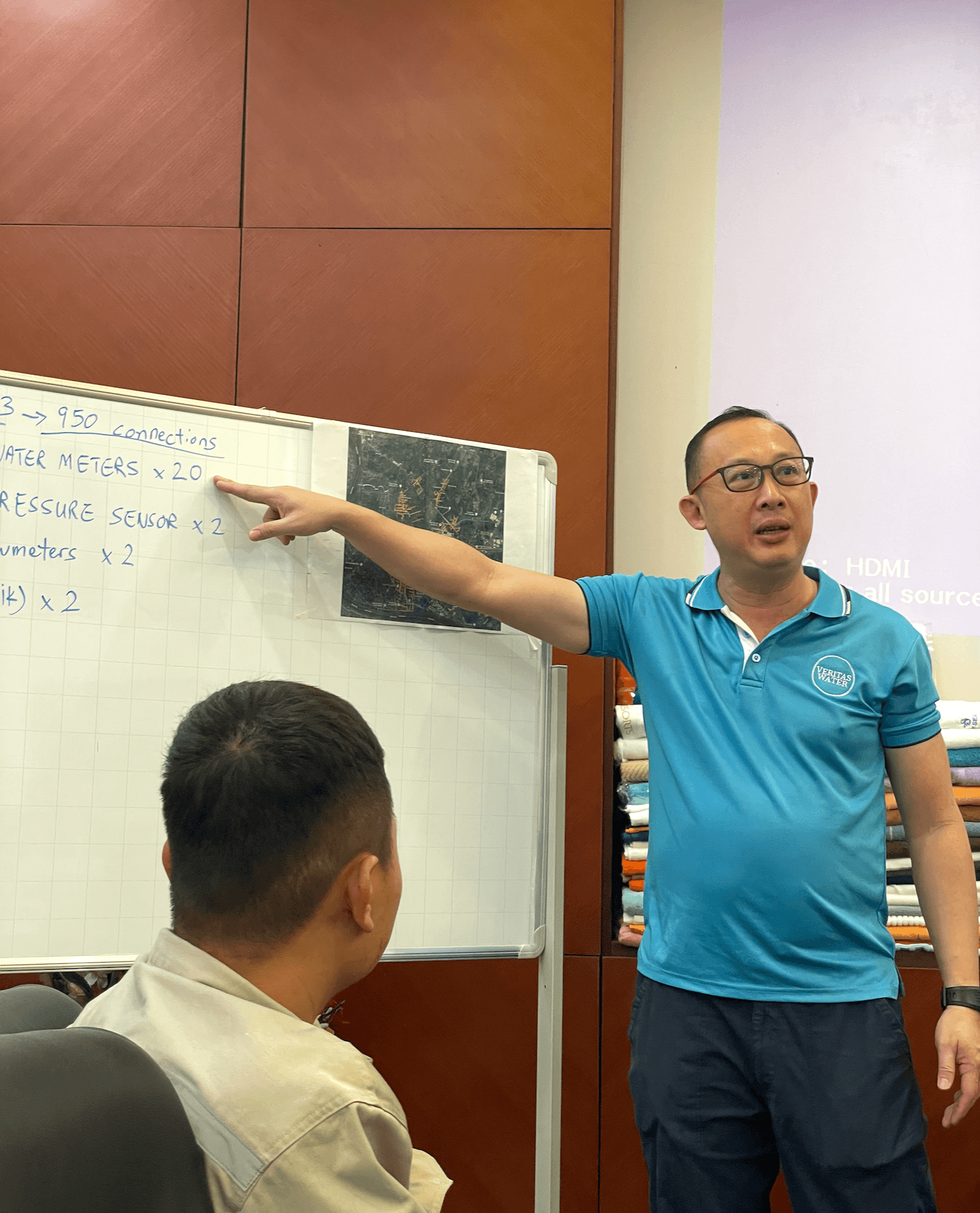 Co-Founder, Aloysius, explaining the deployment plan